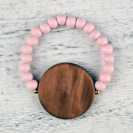 Perlenarmband aus Holz Sonne rosa